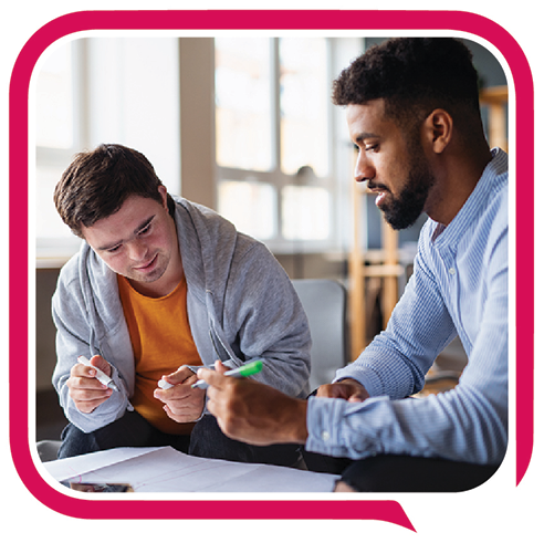 Someone teaching a person to learn a new skill.