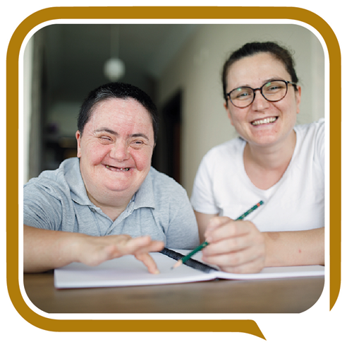 Someone supporting a person. They are both smiling.